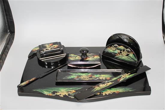 A Chinese Fuzhou (Foochow) lacquer desk set, mid 20th century, the blotter pad holder 45cm wide